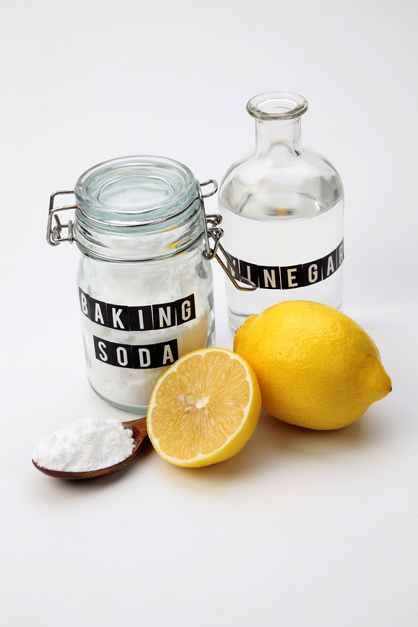 baking soda vinegar and lemon on the white background